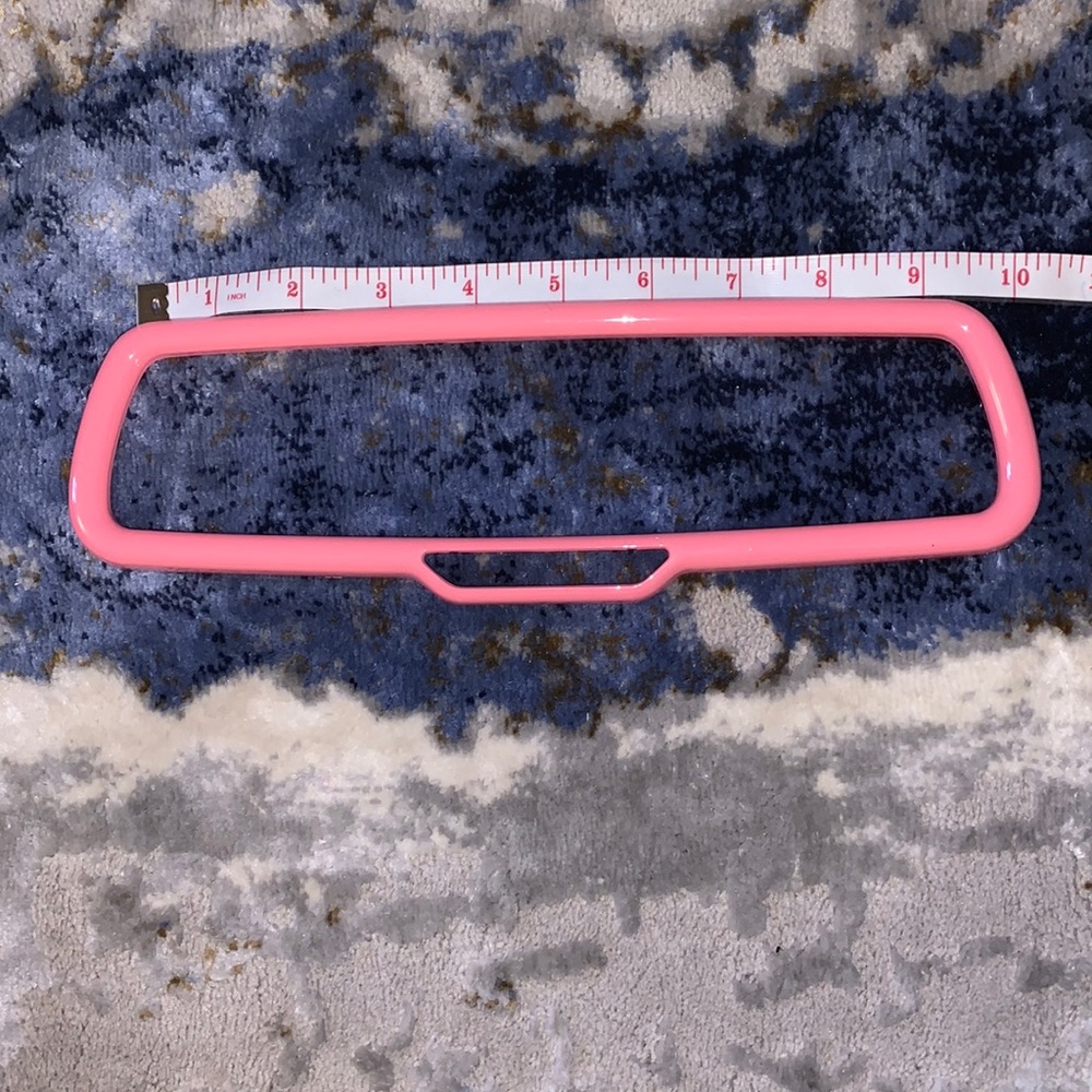 Automobile rear view mirror trim in pink